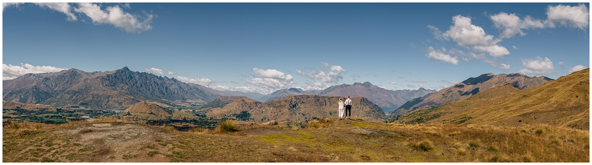 Bride and groom gaze over Queenstown mountains