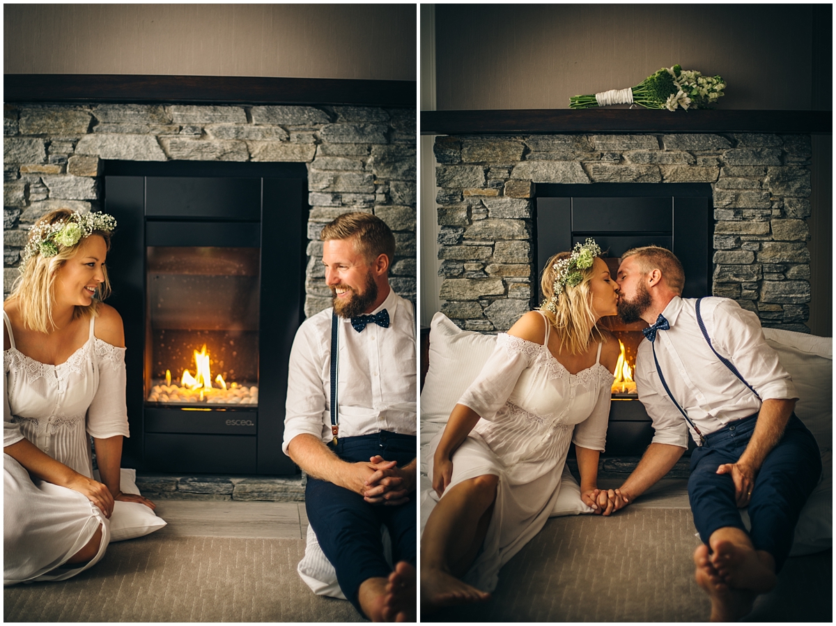 Couple kiss by the fireplace